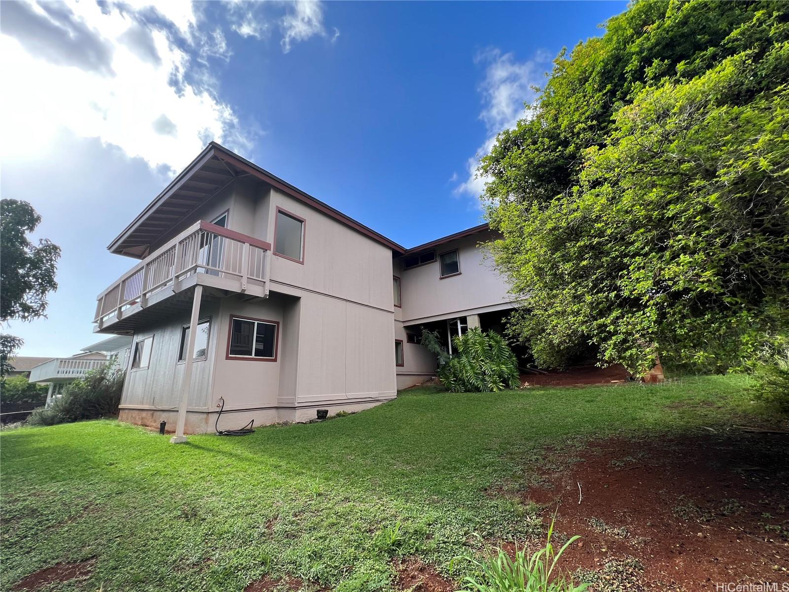 98-1305 Akaaka Street Aiea, HI 96701 - Photo 21 of 23 a front view of a house with garden
