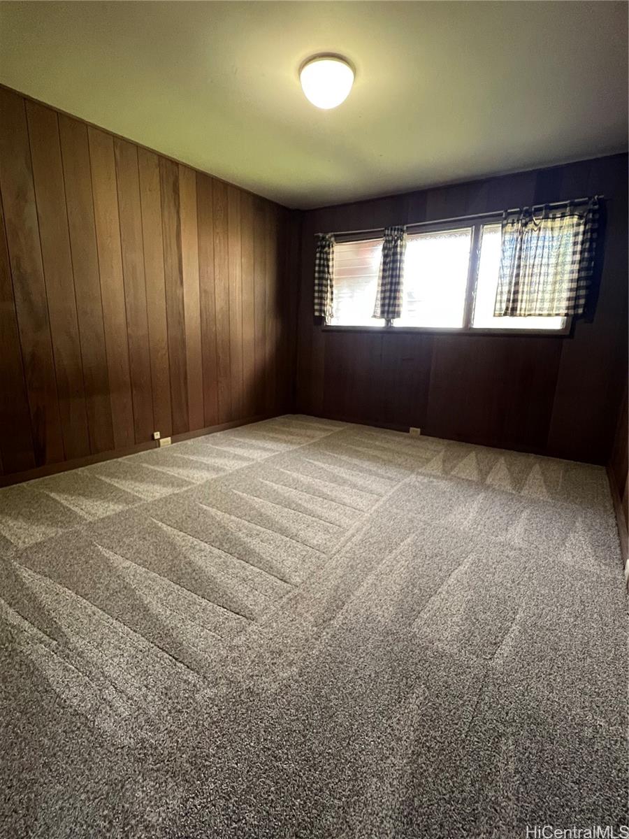 98-1305 Akaaka Street Aiea, HI 96701 - Photo 5 of 23 a view of an empty room and window