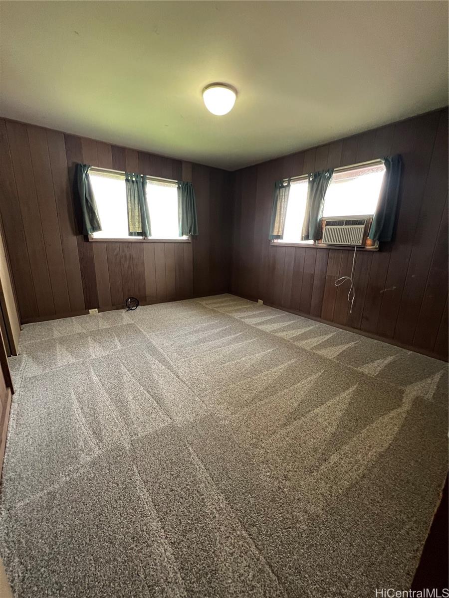 98-1305 Akaaka Street Aiea, HI 96701 - Photo 6 of 23 a view of an empty room and window