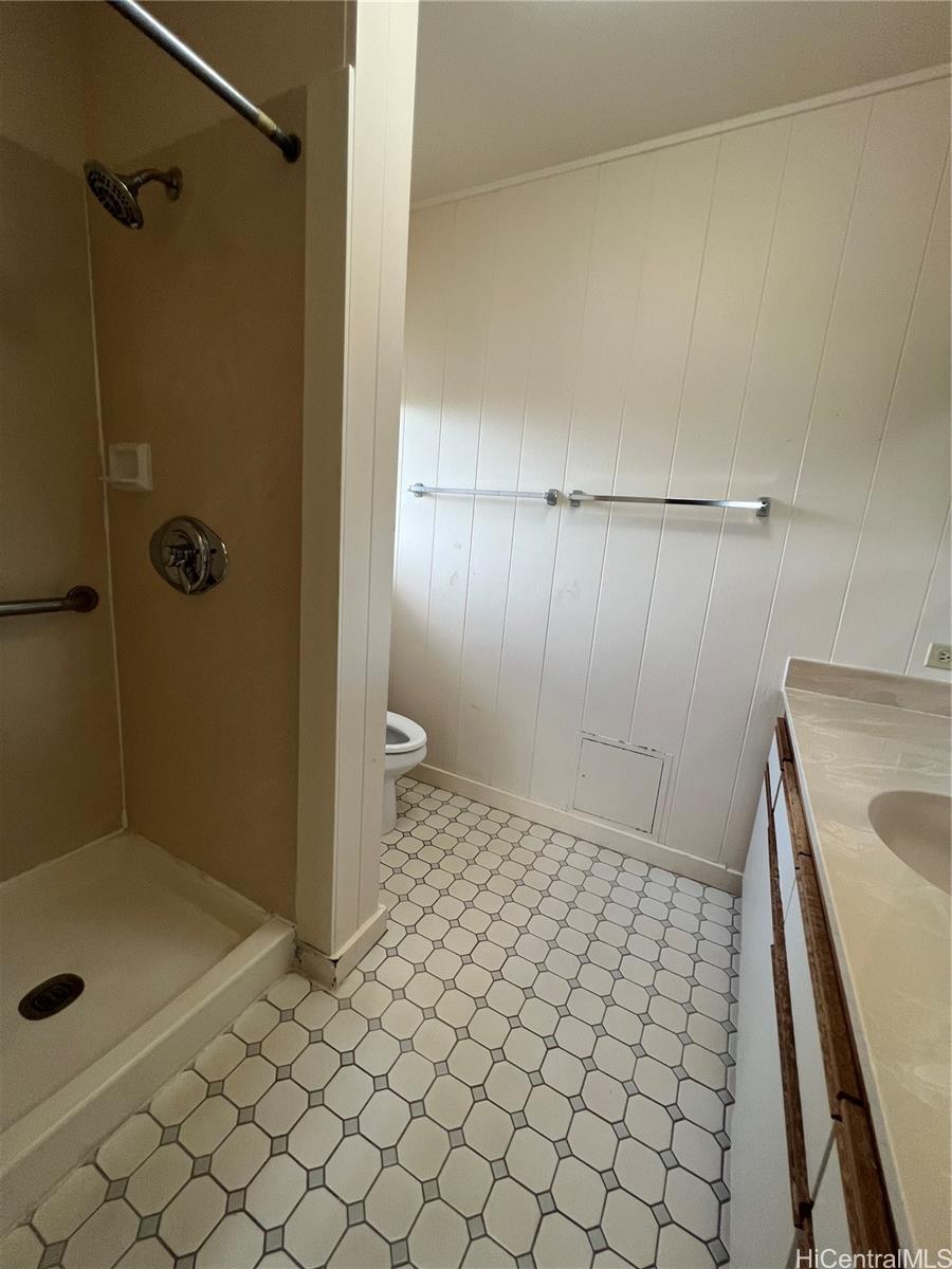 98-1305 Akaaka Street Aiea, HI 96701 - Photo 9 of 23 a bathroom with a sink a toilet and shower
