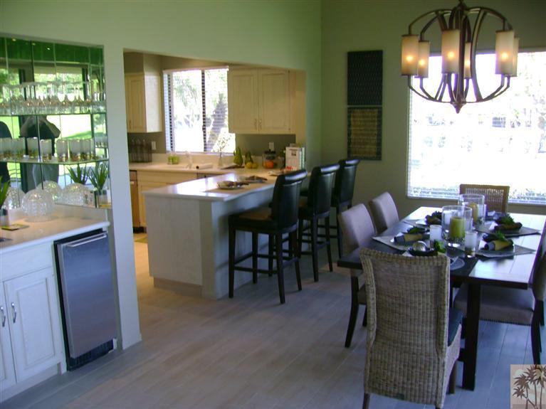 77950 Cherokee Road Indian Wells, CA 92210 - Photo 3 of 22 a view of a dining room with furniture and chandelier