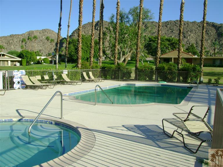 77950 Cherokee Road Indian Wells, CA 92210 - Photo 4 of 22 a view of a swimming pool with a patio