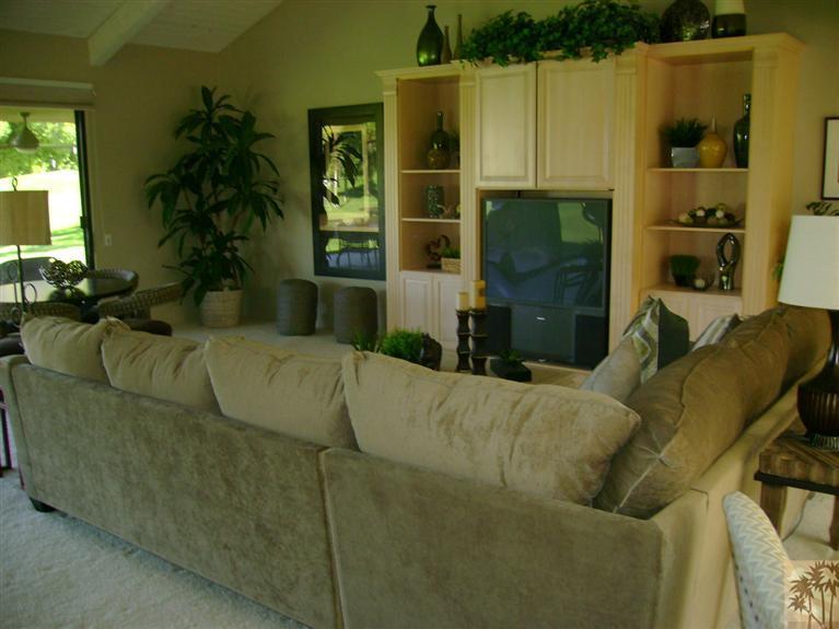 77950 Cherokee Road Indian Wells, CA 92210 - Photo 8 of 22 a living room with furniture a window and a fireplace