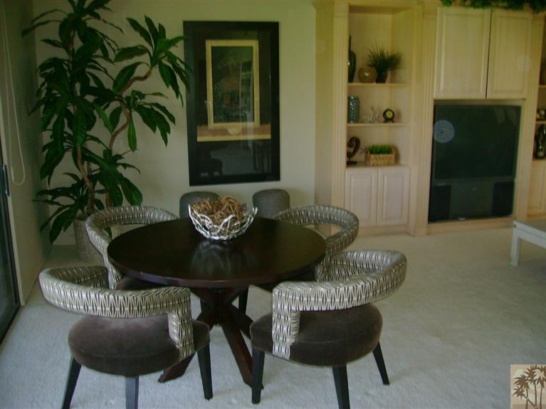 77950 Cherokee Road Indian Wells, CA 92210 - Photo 9 of 22 a table and chairs in a livingroom