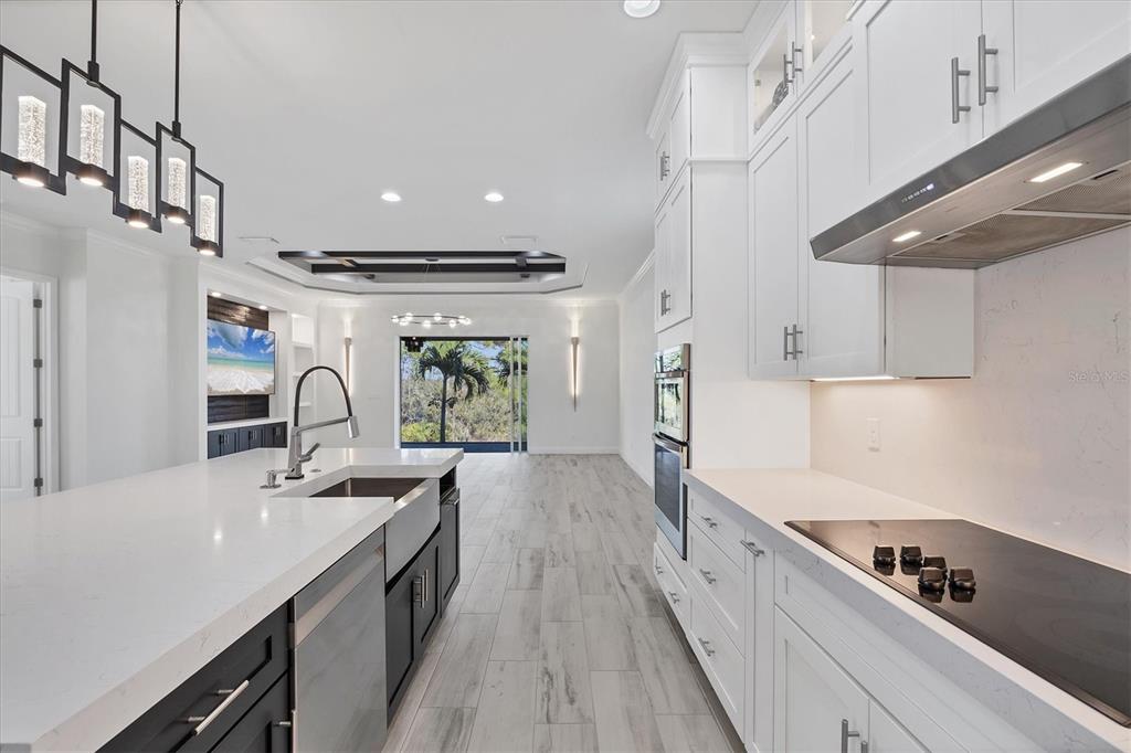 8920 Conch Avenue Placida, FL 33946 - Photo 13 of 57 a kitchen with stainless steel appliances a sink stove and cabinets