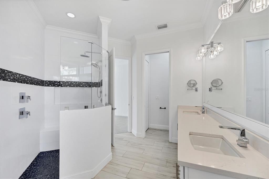 8920 Conch Avenue Placida, FL 33946 - Photo 21 of 57 a bathroom with a sink a mirror and a shower