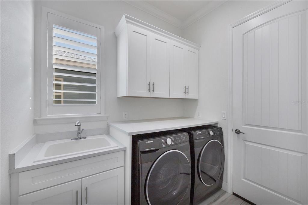 8920 Conch Avenue Placida, FL 33946 - Photo 26 of 57 a utility room with sink dryer and washer