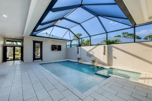 a front view of a house with outdoor seating