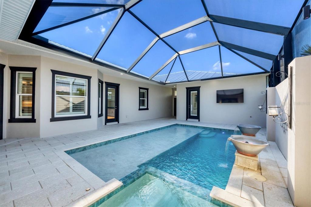 8920 Conch Avenue Placida, FL 33946 - Photo 28 of 57 a front view of a house with outdoor seating