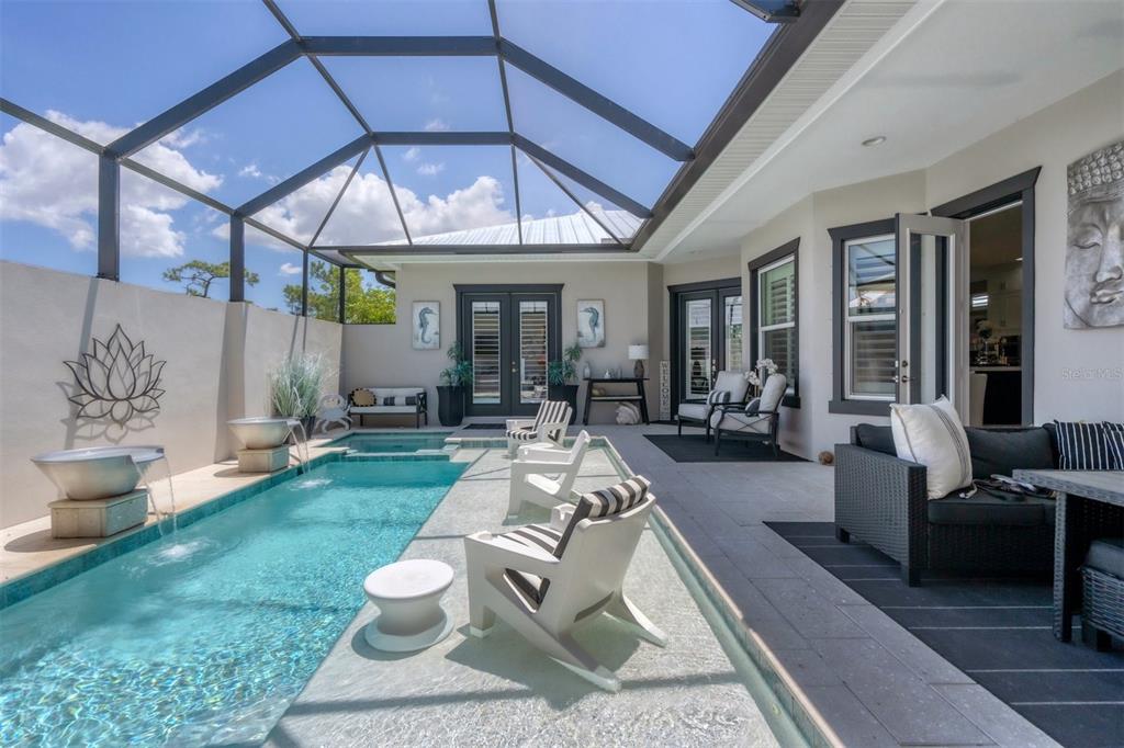 8920 Conch Avenue Placida, FL 33946 - Photo 32 of 57 a view of a patio with couches table and chairs