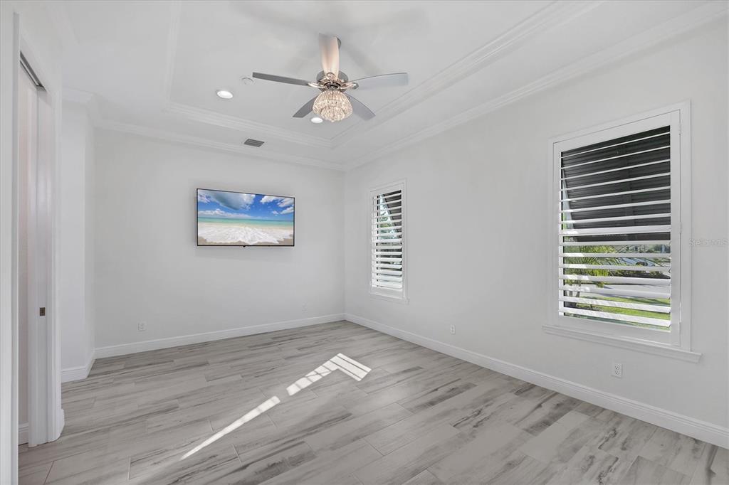 8920 Conch Avenue Placida, FL 33946 - Photo 33 of 57 a view of empty room with wooden floor and fan