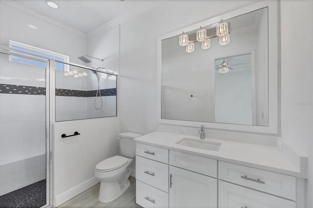 8920 Conch Avenue Placida, FL 33946 - Photo 34 of 57 a bathroom with a toilet a sink and shower