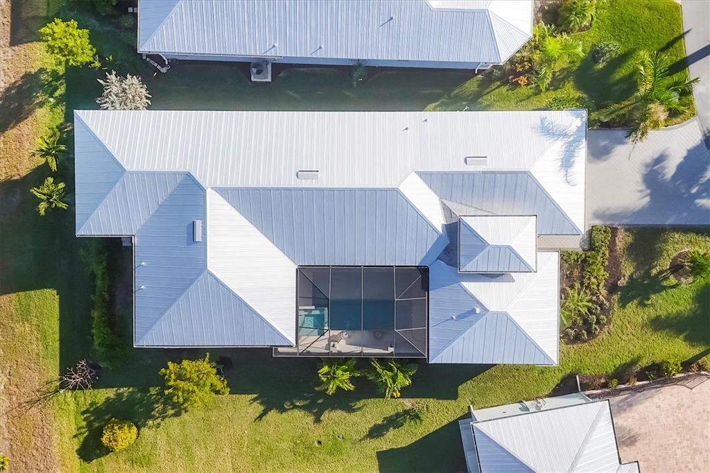 8920 Conch Avenue Placida, FL 33946 - Photo 45 of 57 an aerial view of a house with a yard and a car parked
