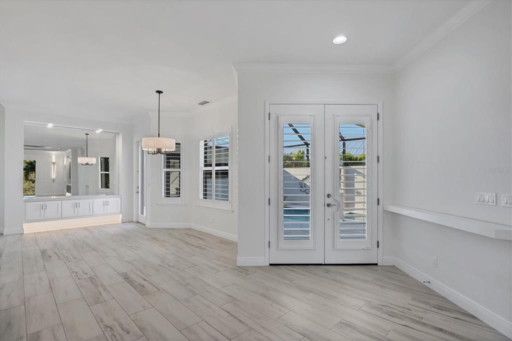 8920 Conch Avenue Placida, FL 33946 - Photo 5 of 57 an empty room with wooden floor and windows