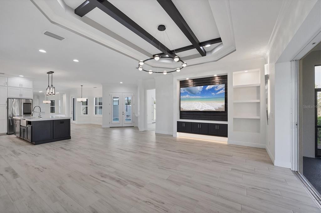 8920 Conch Avenue Placida, FL 33946 - Photo 8 of 57 a room with stainless steel appliances kitchen island wooden floors and view living room