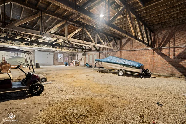 a view of a room with wooden floor and furniture