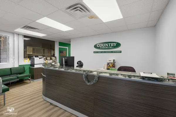 a view of a kitchen with granite countertop a sink and a stove