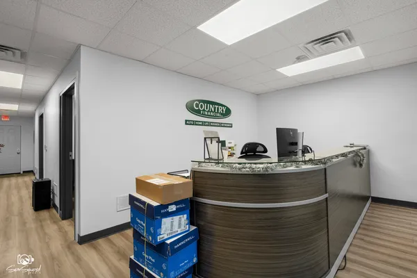 a view of living room with furniture and wooden floor