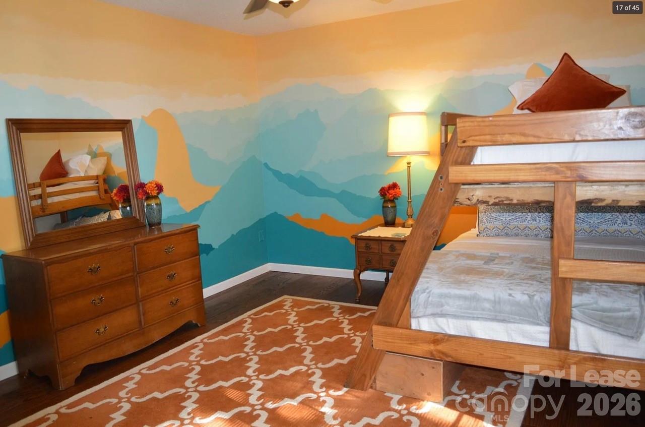 4167 Greenview Court Fort Mill, SC 29708 - Photo 11 of 16 a bedroom with a bed and wooden floor