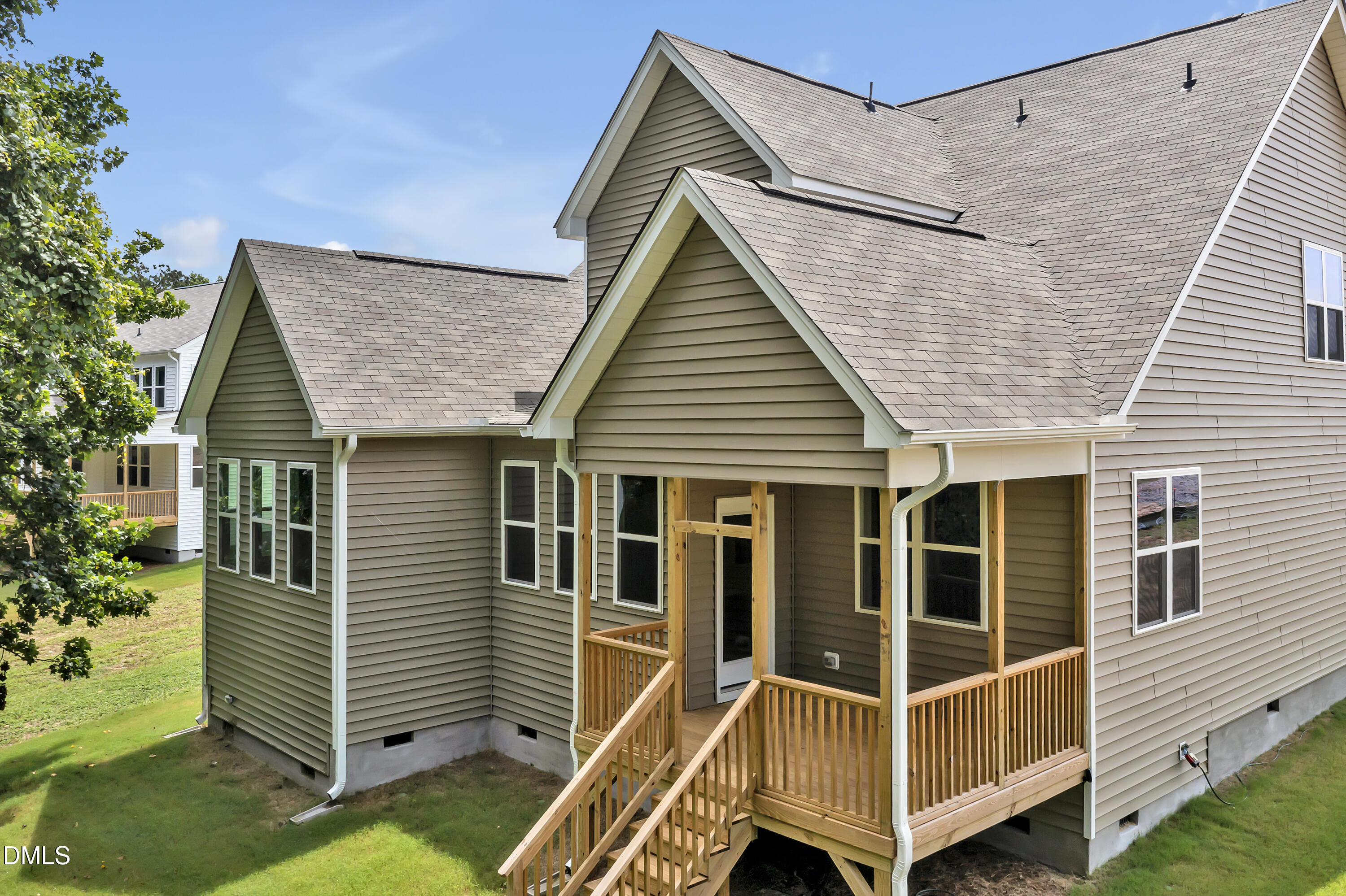 294 White Azalea Way Benson, NC 27504 - Photo 12 of 15 a view of house with a large window and wooden fence