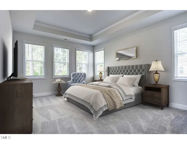 a spacious bedroom with a bed and a couch