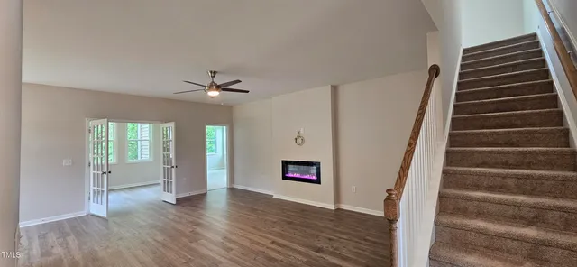 wooden floor in an empty room with a window