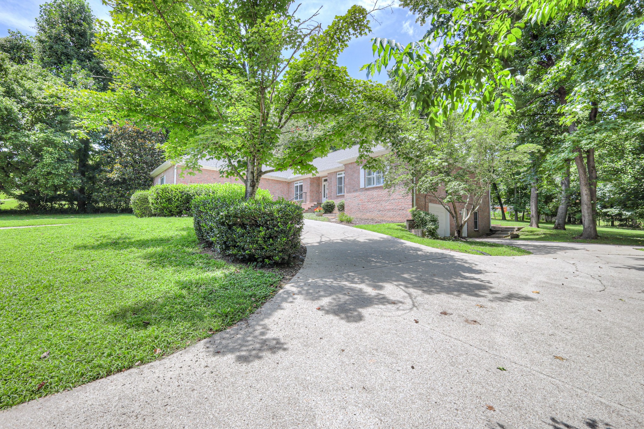 604 Georgian Way Mount Juliet, TN 37122 - Photo 2 of 58 a front view of a house with garden