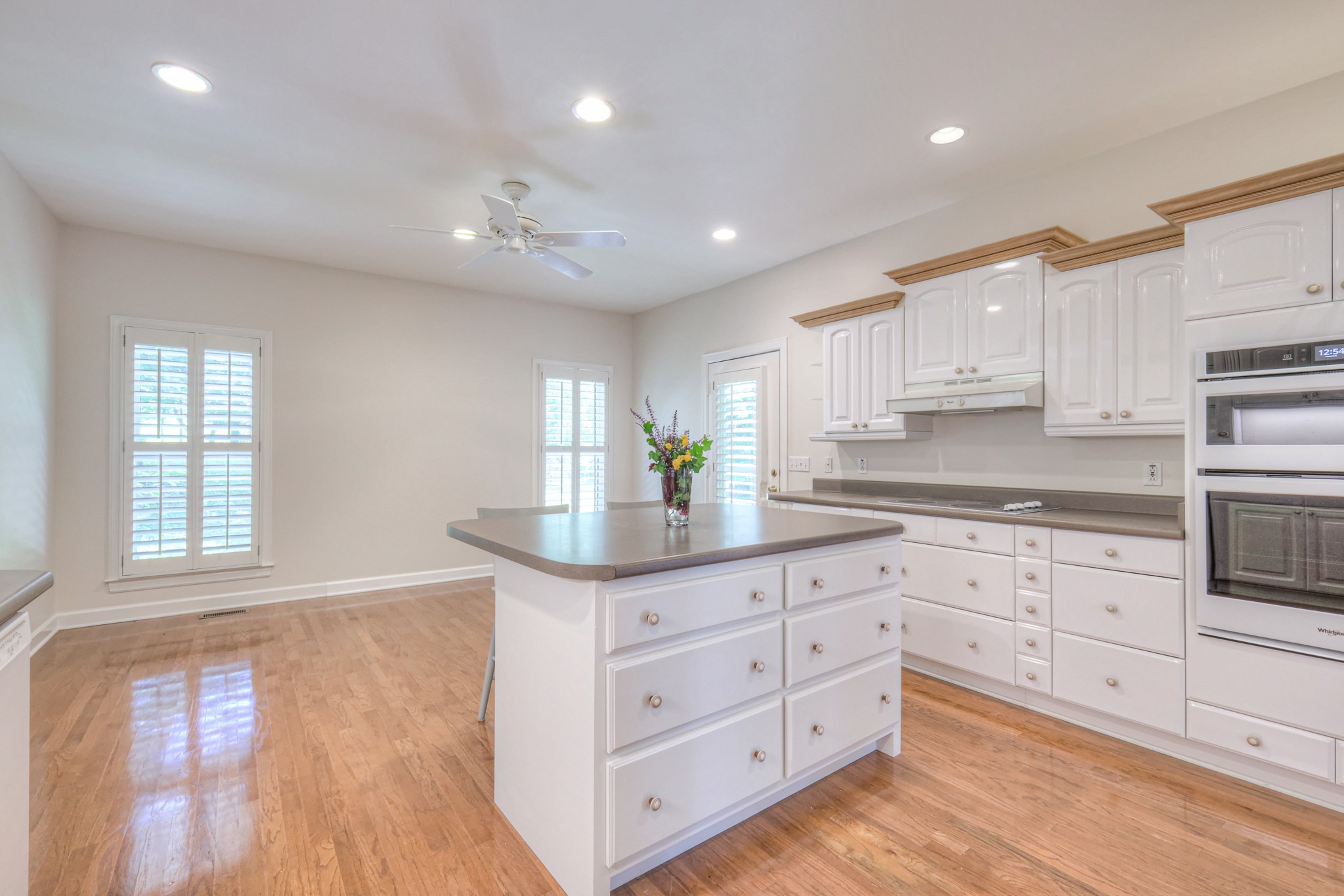 604 Georgian Way Mount Juliet, TN 37122 - Photo 25 of 58 a kitchen with granite countertop white cabinets and white appliances