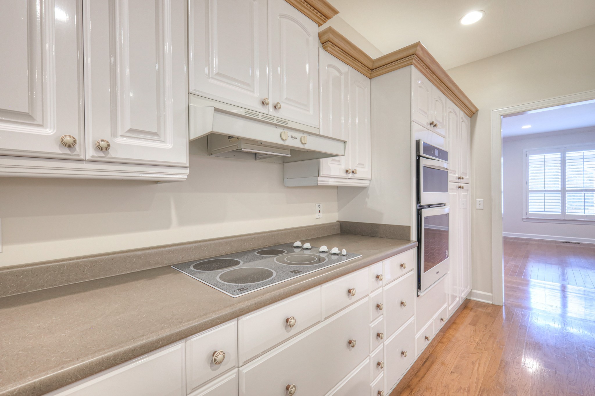 604 Georgian Way Mount Juliet, TN 37122 - Photo 29 of 58 a kitchen with white cabinets and appliances