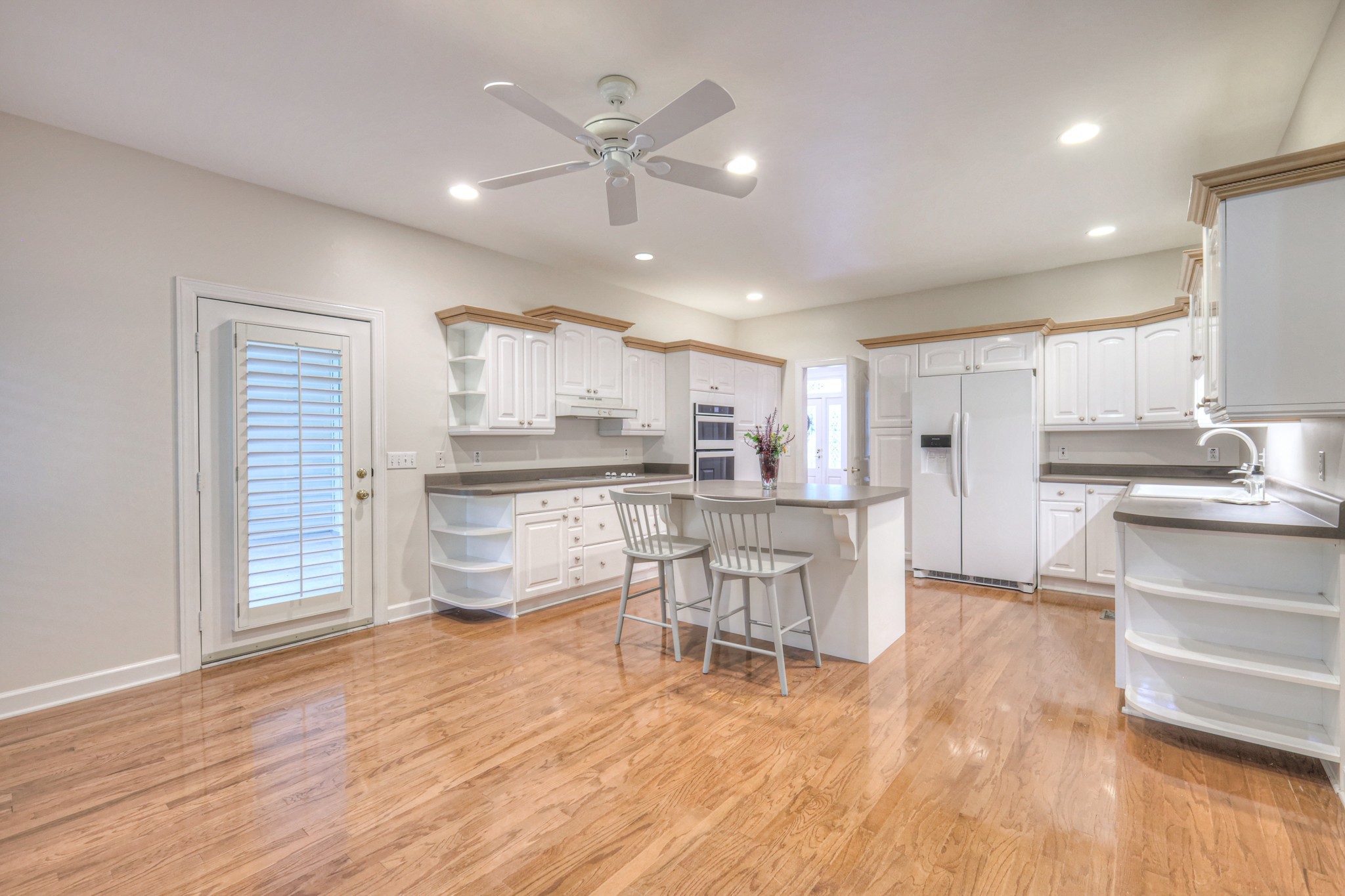 604 Georgian Way Mount Juliet, TN 37122 - Photo 30 of 58 a kitchen with stainless steel appliances kitchen island granite countertop a sink cabinets and wooden floor