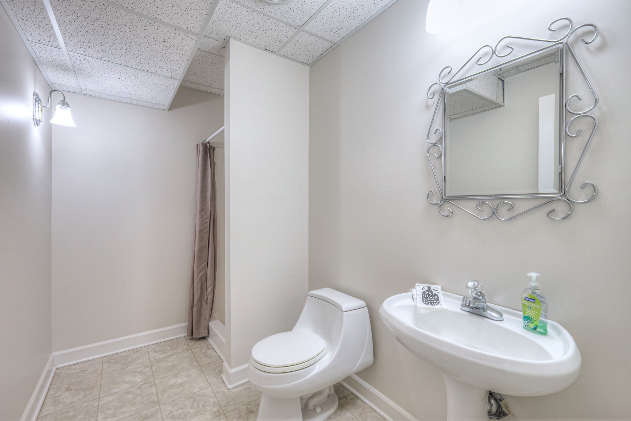 604 Georgian Way Mount Juliet, TN 37122 - Photo 46 of 58 a bathroom with a sink toilet and mirror