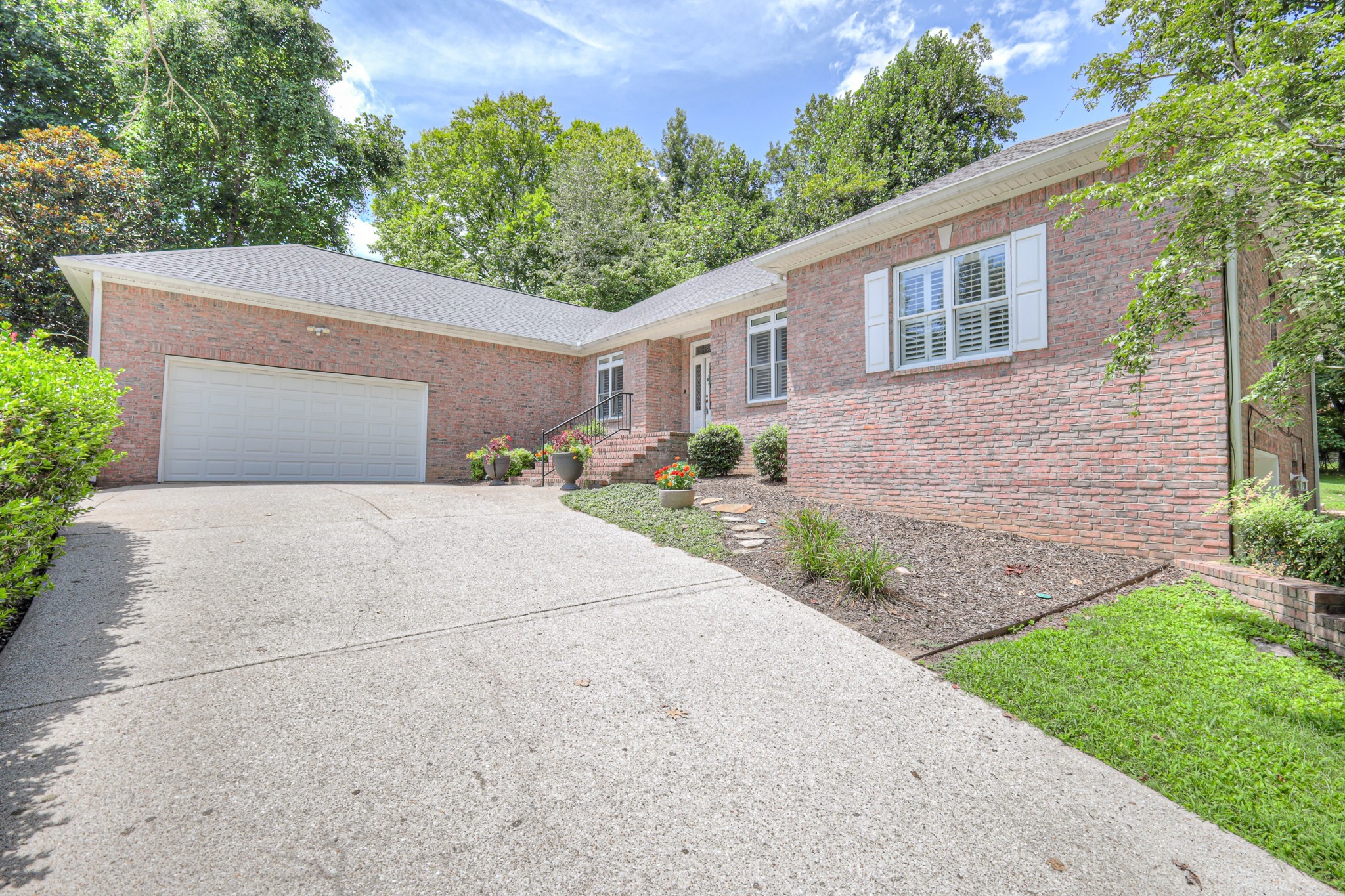 604 Georgian Way Mount Juliet, TN 37122 - Photo 50 of 58 a front view of a house with a yard and a garage
