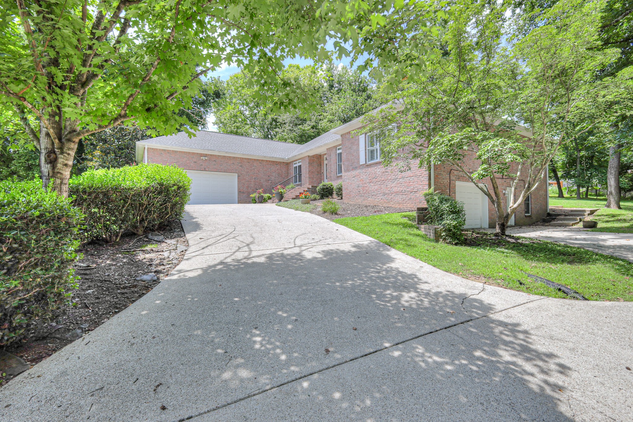 604 Georgian Way Mount Juliet, TN 37122 - Photo 51 of 58 a front view of a house with a yard and a garage