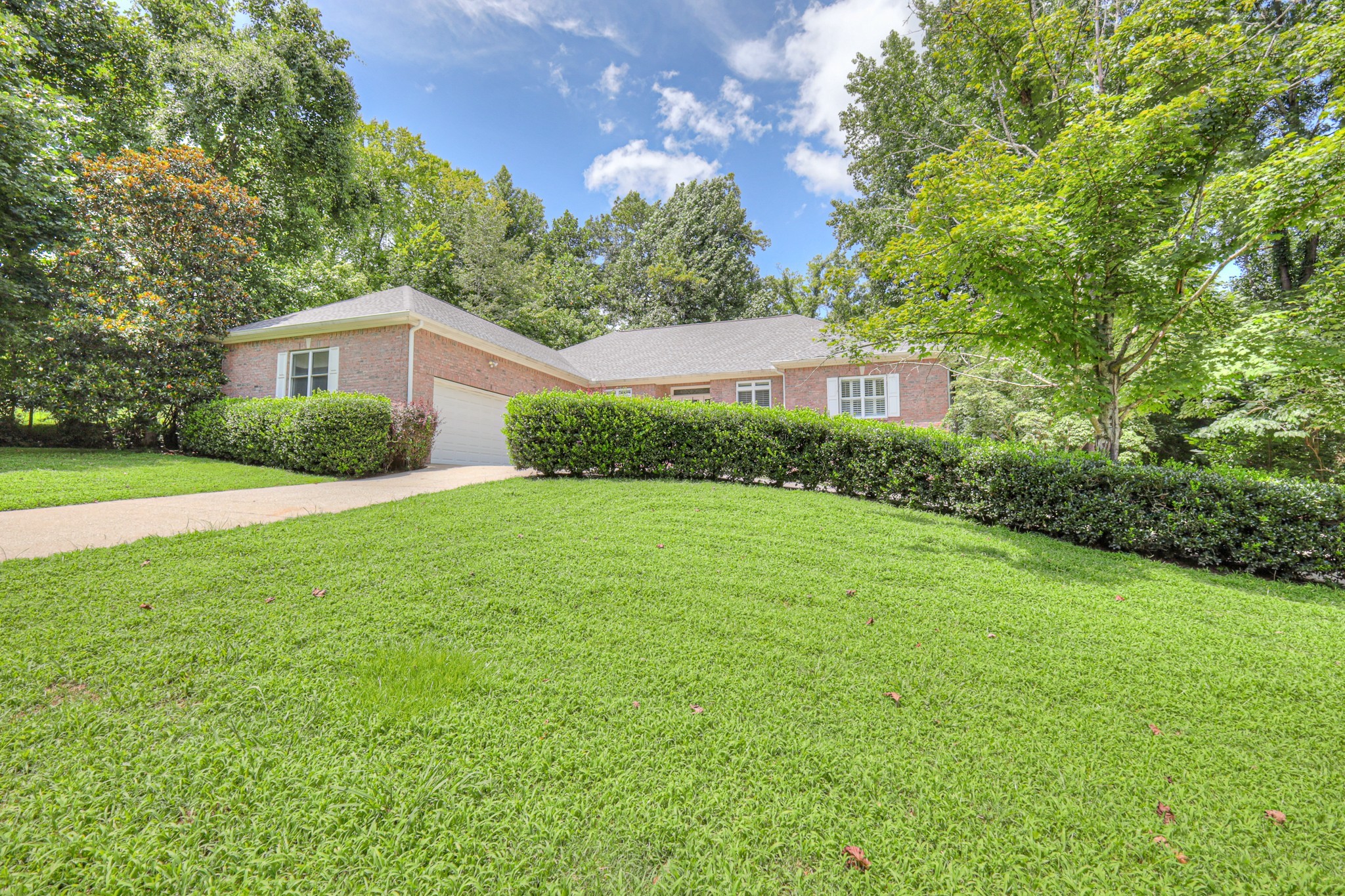604 Georgian Way Mount Juliet, TN 37122 - Photo 52 of 58 a front view of a house with yard and green space