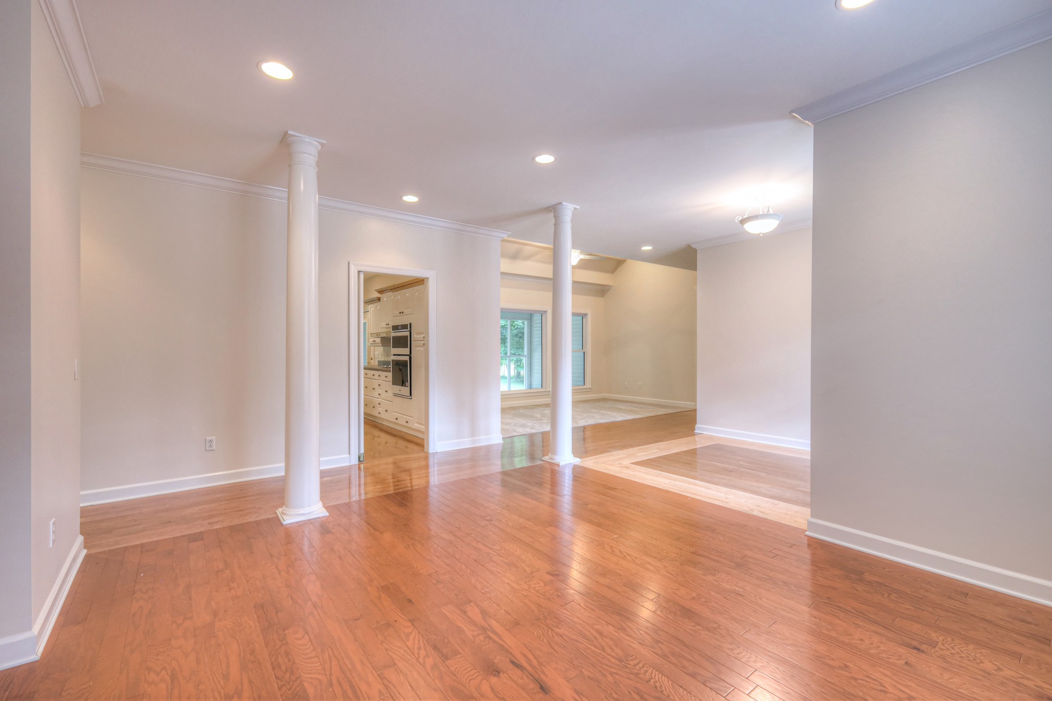 604 Georgian Way Mount Juliet, TN 37122 - Photo 10 of 58 a view of an empty room with wooden floor and a window