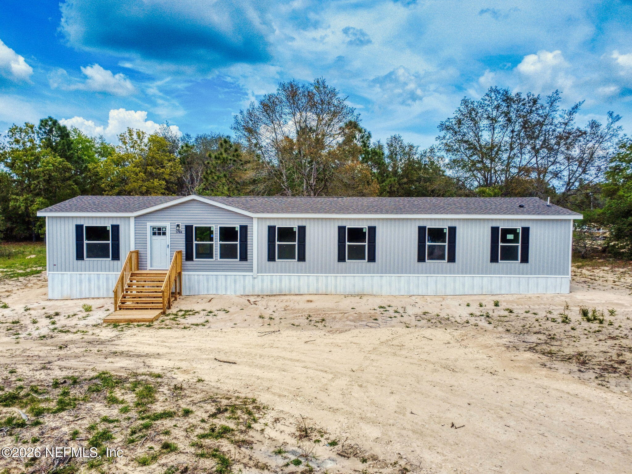 5784 County Road 214 Keystone Heights, FL 32656 - Photo 1 of 62 a view of a house with snow on the background