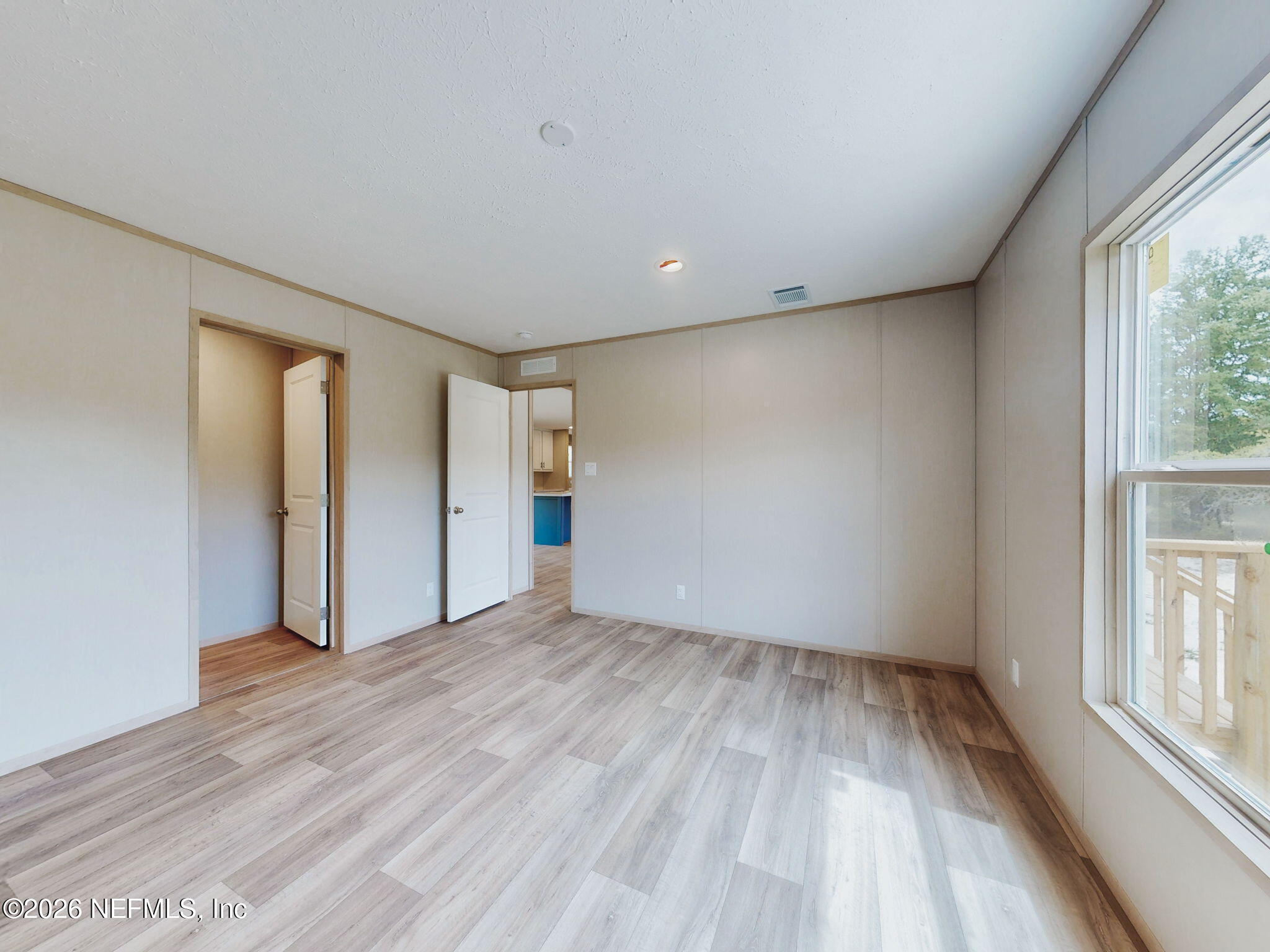5784 County Road 214 Keystone Heights, FL 32656 - Photo 11 of 62 wooden floor in an empty room with a window