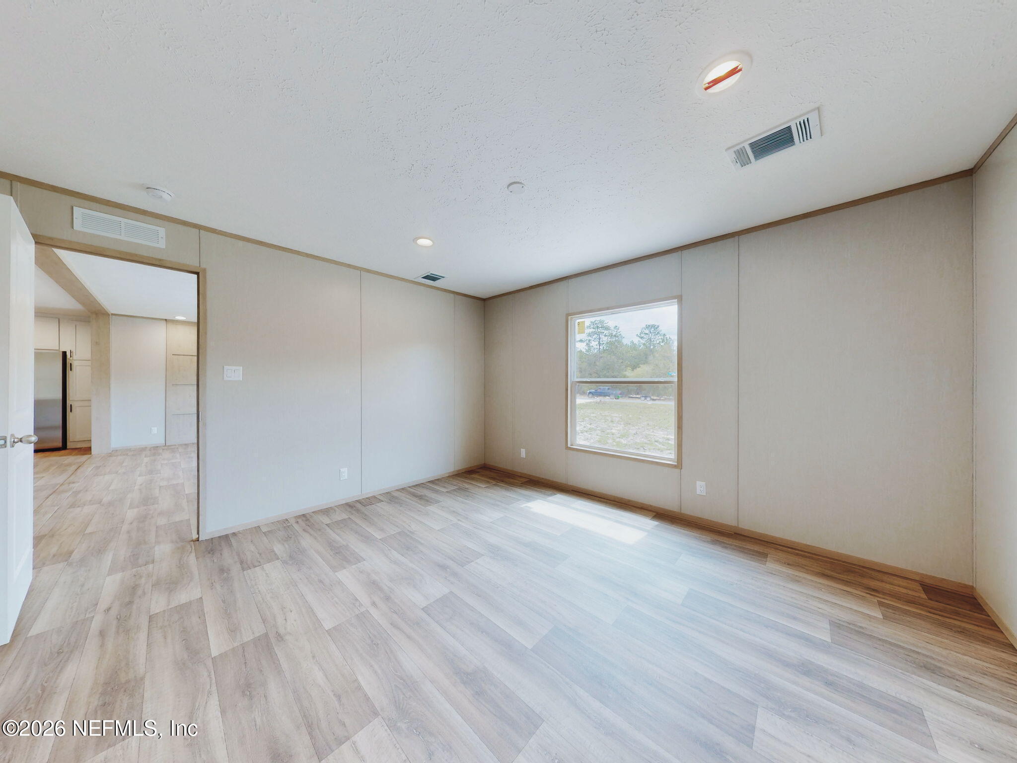 5784 County Road 214 Keystone Heights, FL 32656 - Photo 12 of 62 wooden floor in an empty room with a window