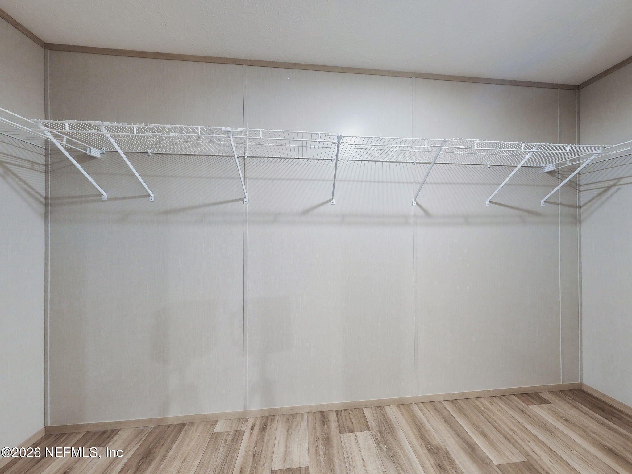 5784 County Road 214 Keystone Heights, FL 32656 - Photo 18 of 62 a view of a room with racks on the wall