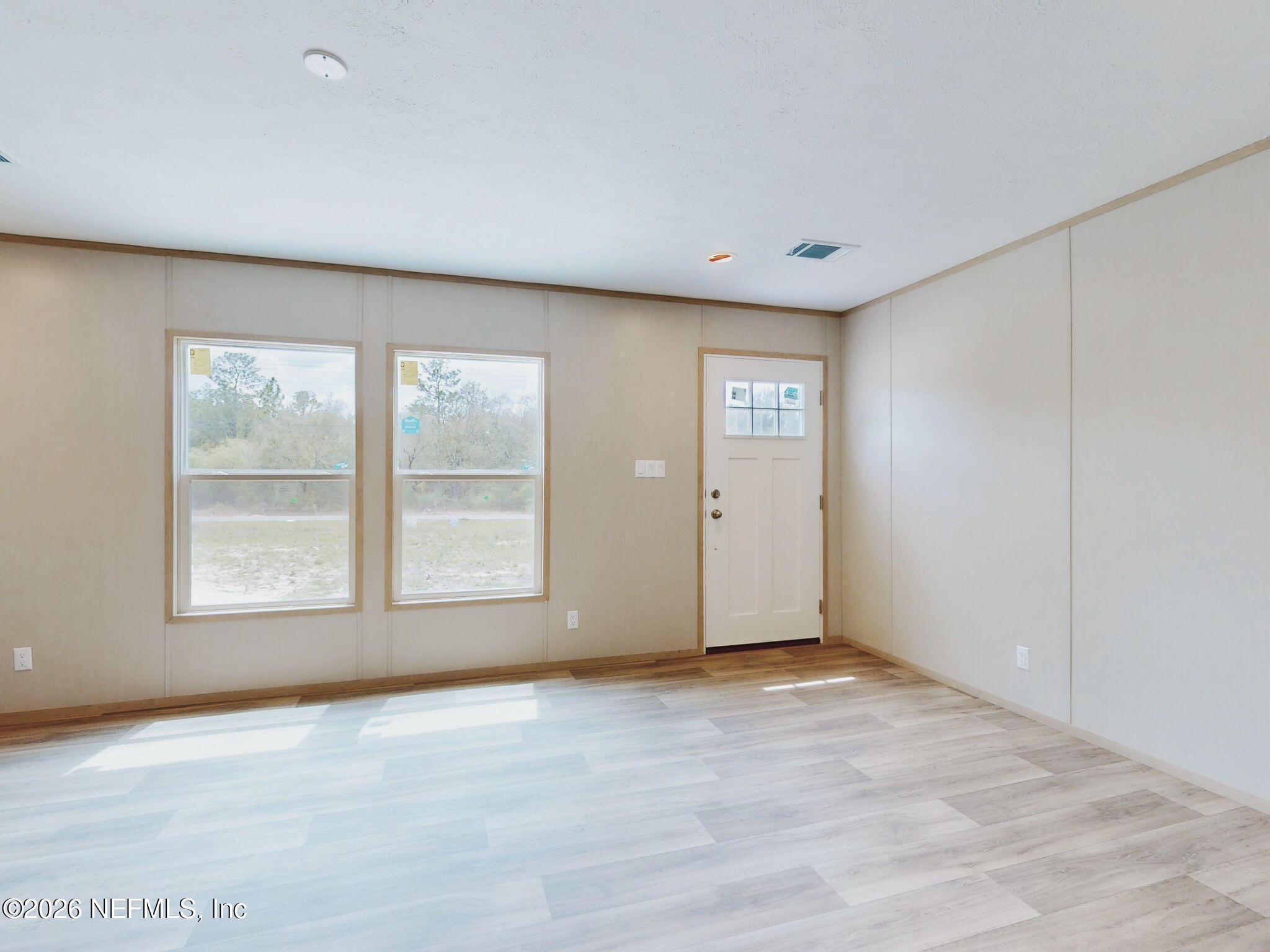 5784 County Road 214 Keystone Heights, FL 32656 - Photo 2 of 62 an empty room with windows