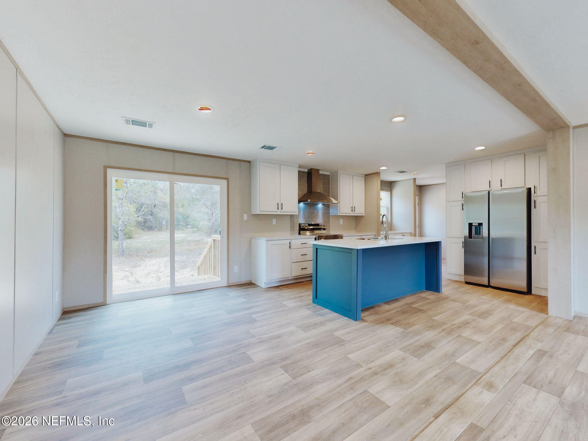5784 County Road 214 Keystone Heights, FL 32656 - Photo 21 of 62 a view of kitchen with wooden floor and window
