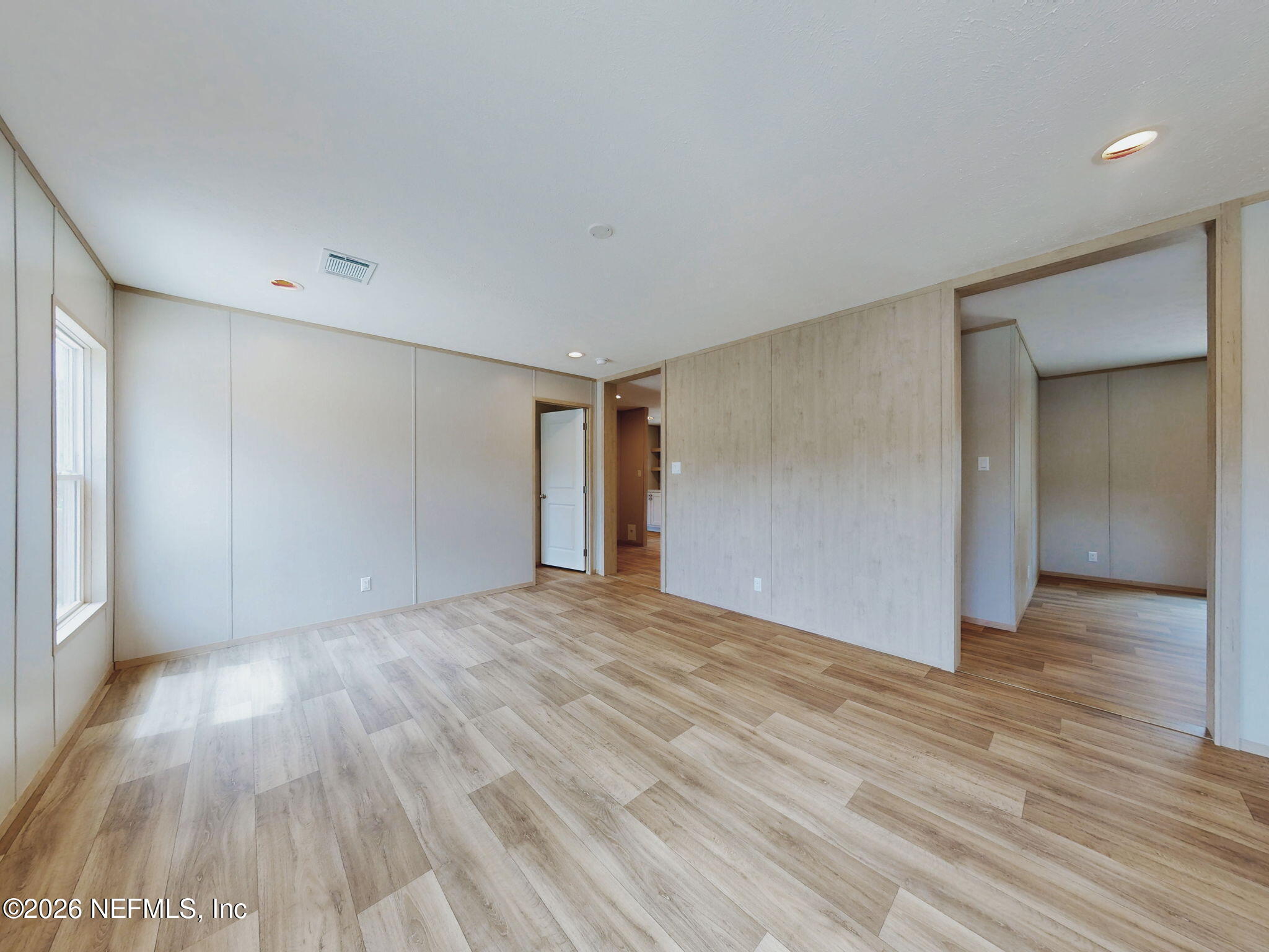 5784 County Road 214 Keystone Heights, FL 32656 - Photo 41 of 62 a view of an empty room with wooden floor
