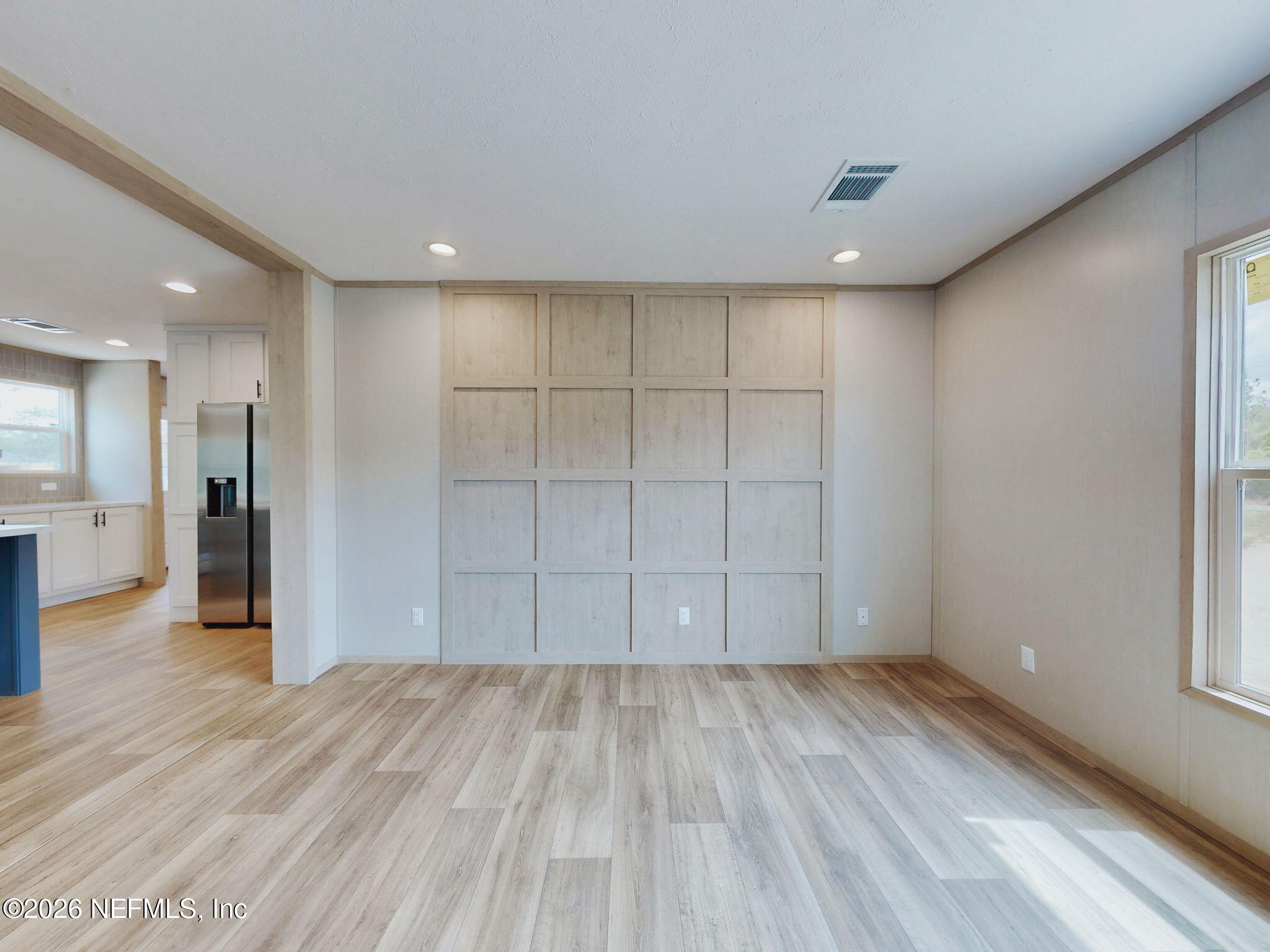 5784 County Road 214 Keystone Heights, FL 32656 - Photo 5 of 62 wooden floor in an empty room with a kitchen
