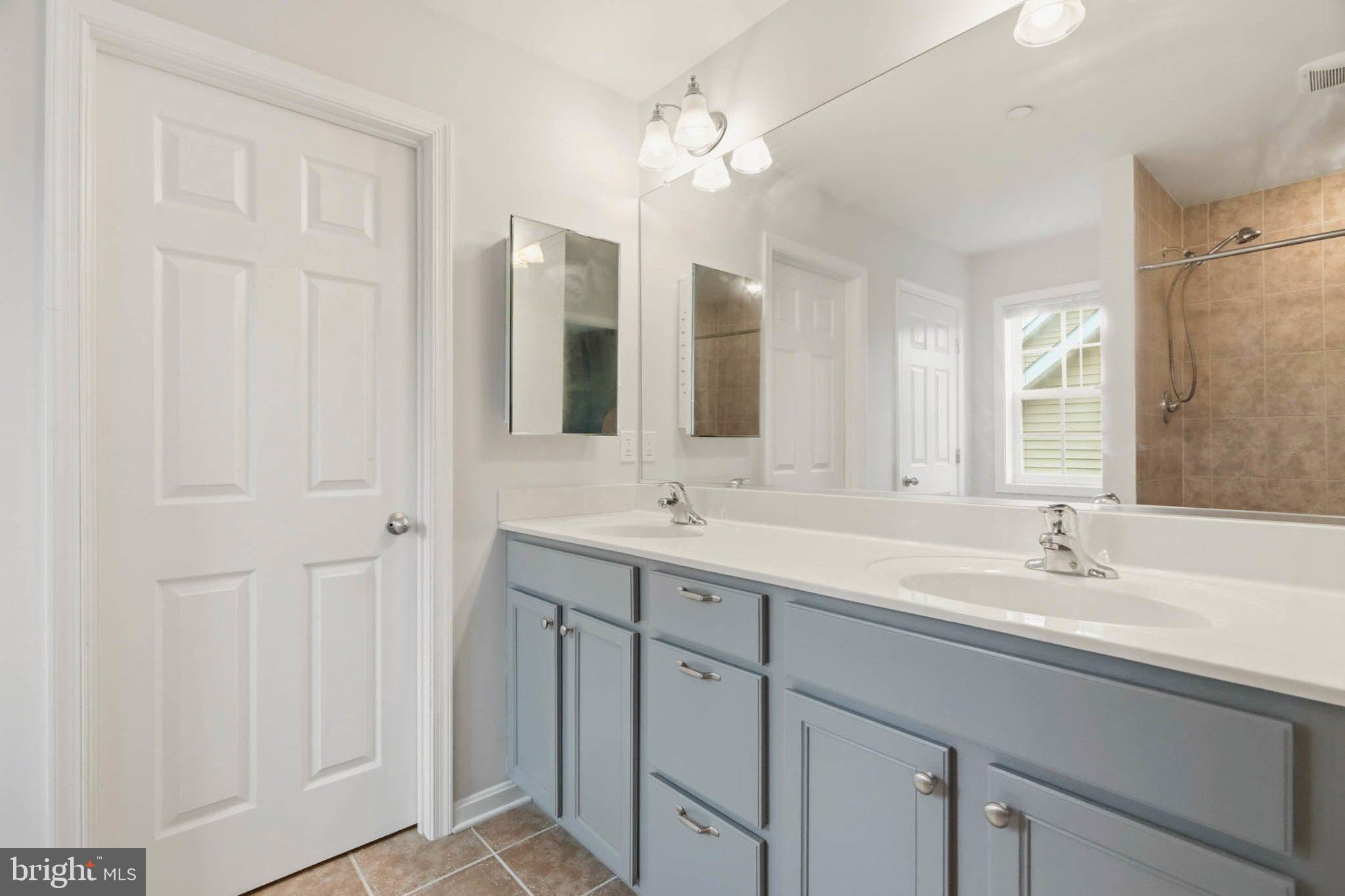 706 Trapper Way Deale, MD 20751 - Photo 28 of 61 Modern elegance in a serene bathroom.