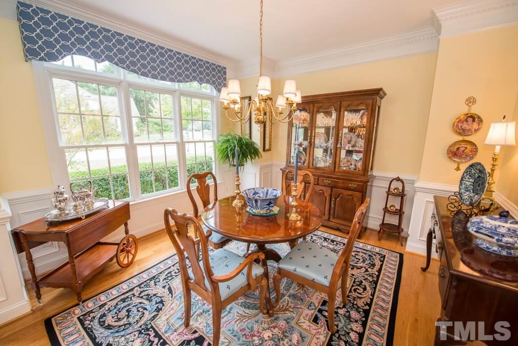 103 Springmoor Lane Durham, NC 27713 - Photo 3 of 25 Elegant formal dining room with wainscoting, heavy crown and dentil mouldings.