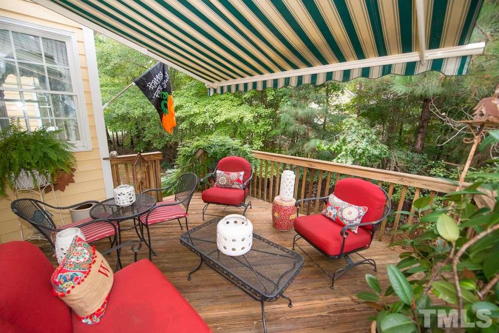 103 Springmoor Lane Durham, NC 27713 - Photo 21 of 25 Deck with retractable awning makes for a nice, shady area to sit outside in the very private back yard.