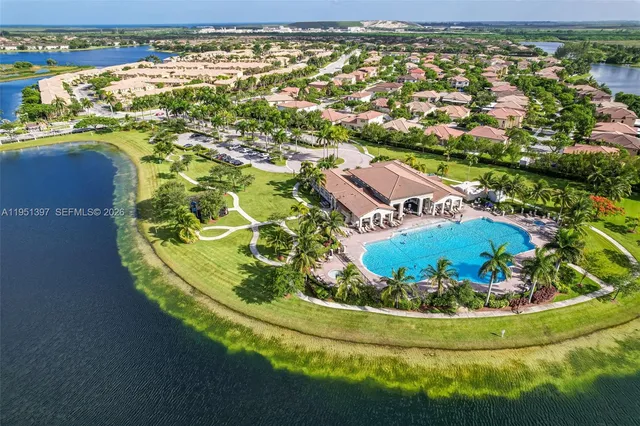 an aerial view of a house with a swimming pool