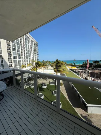 a view of a balcony with chairs