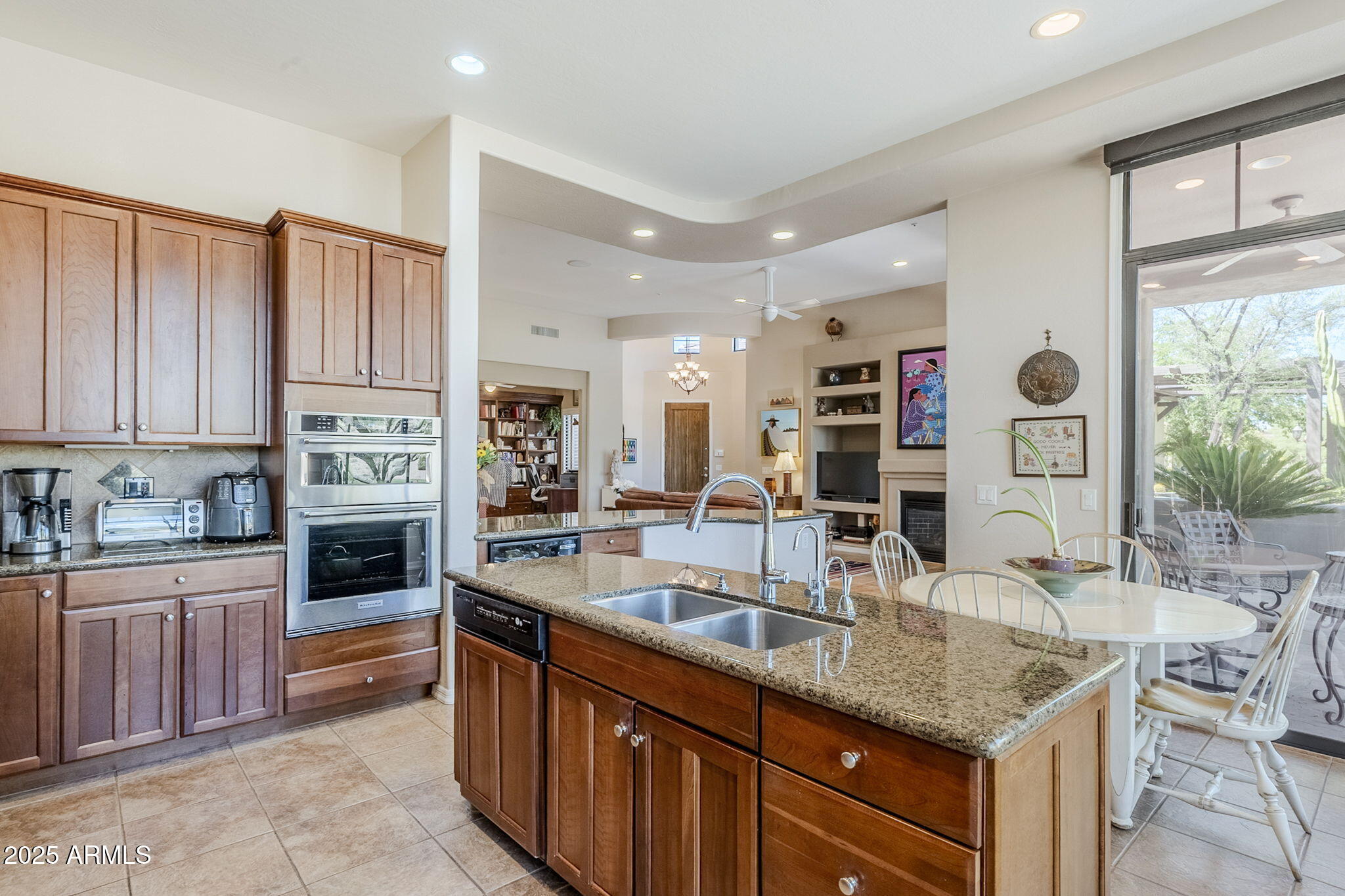 9270 East Thompson Peak Parkway, Unit 342 Scottsdale, AZ 85255 - Photo 15 of 40 a kitchen with stainless steel appliances granite countertop a stove sink and cabinets