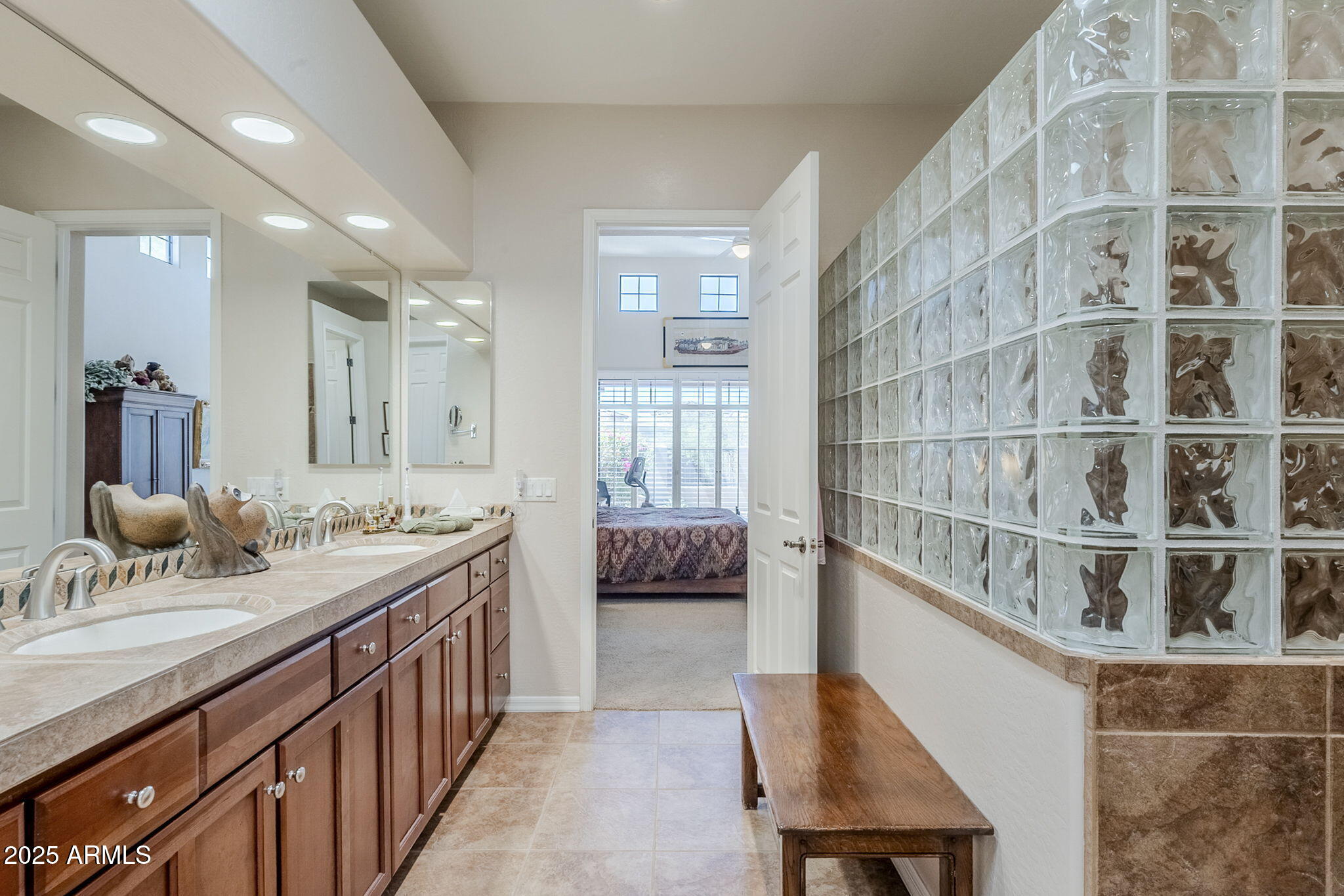 9270 East Thompson Peak Parkway, Unit 342 Scottsdale, AZ 85255 - Photo 23 of 40 a bathroom with a double vanity sink a mirror and shower
